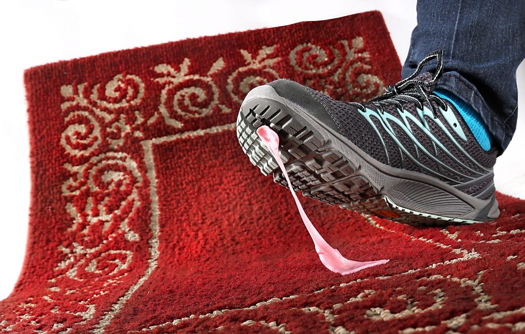 How to remove gum from an area rug.