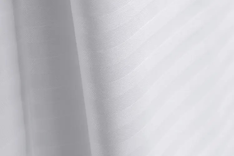 a close up of a Comfortwill flat sheet from Standard Textile