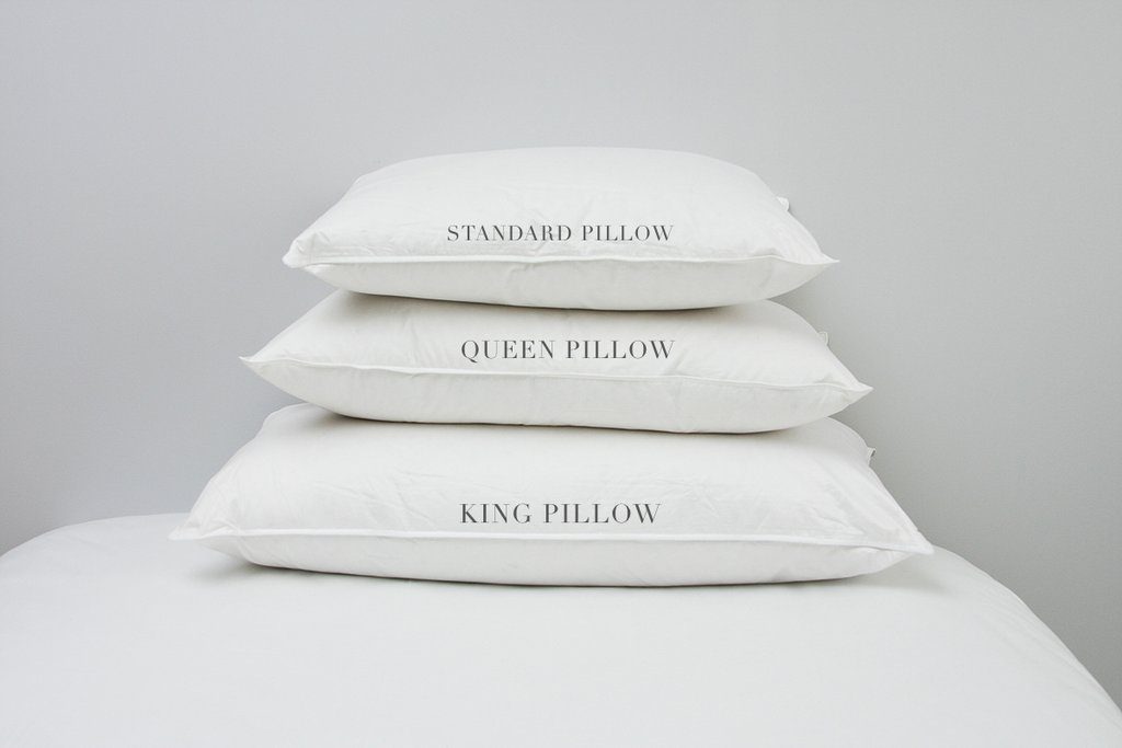 standard, queen, and king pillows stacked on top of each other