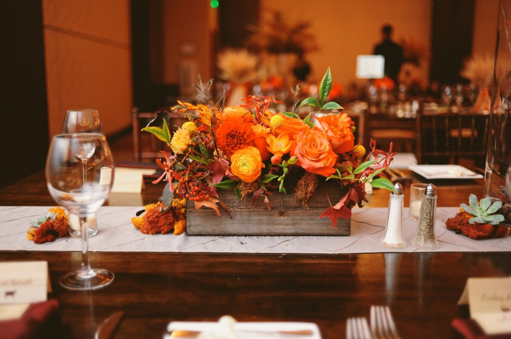 a table runner on a fall-themed table