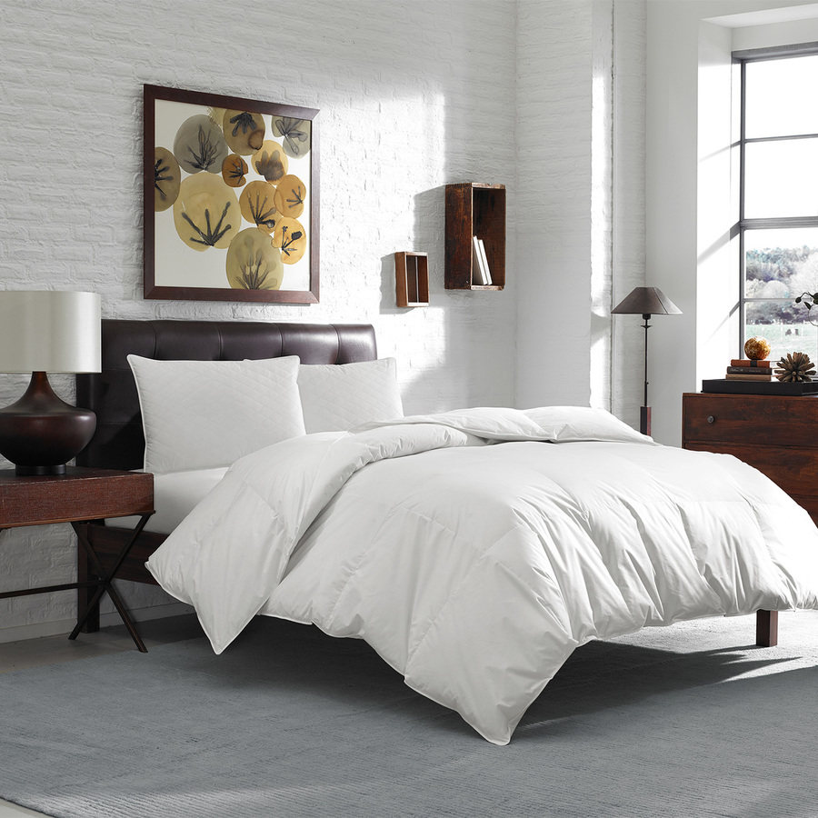 a white goose down comforter on a bed