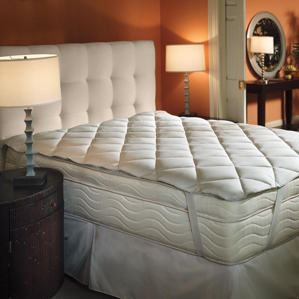 a featherbed with straps, on a mattress