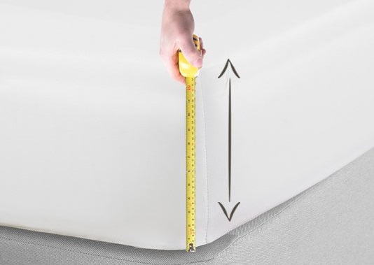 measuring the depth of a mattress