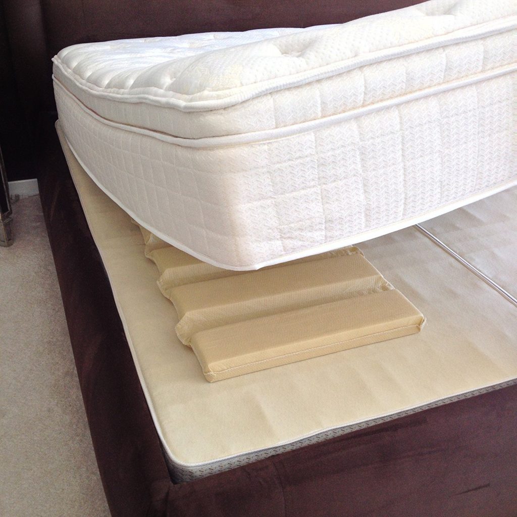 The Under Mattress Support from Mattress Helper on one side of the bed