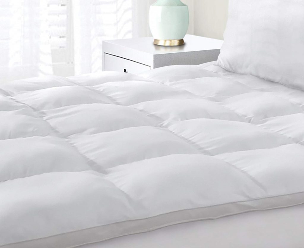 a mattress pad on a bed