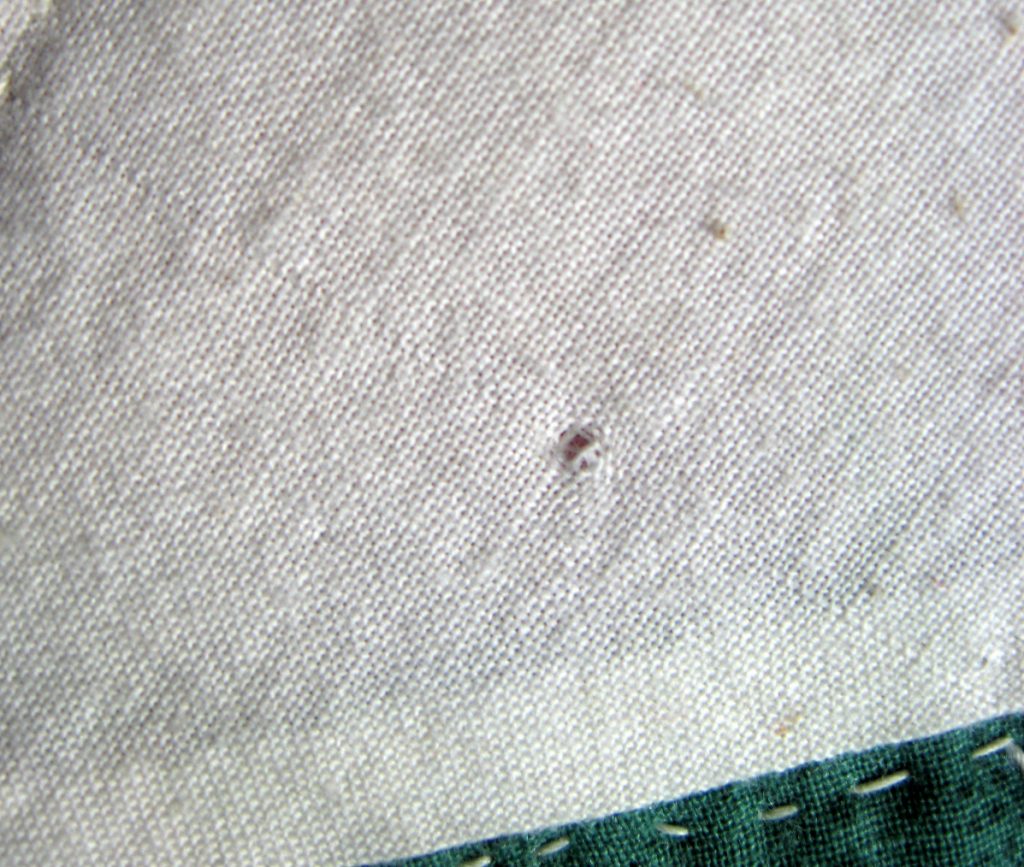 holes in fabric from a safety pin