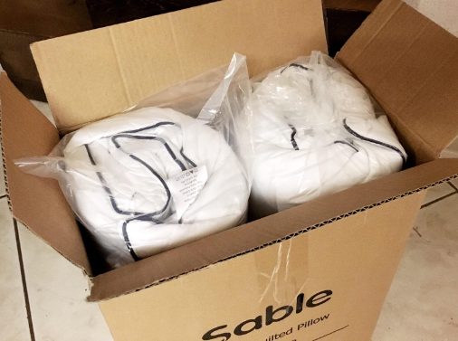 Two Sable pillows packaged in a box for shipping