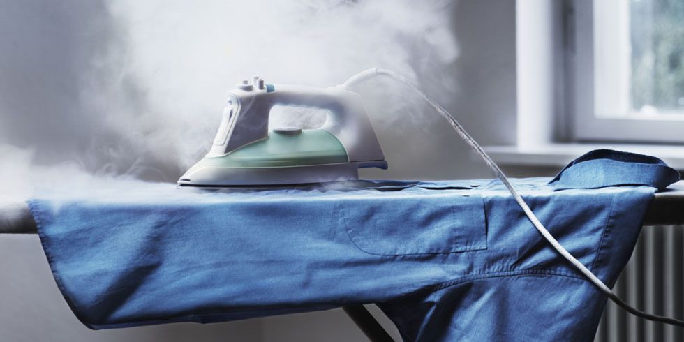 steam coming out of an iron on an ironing board