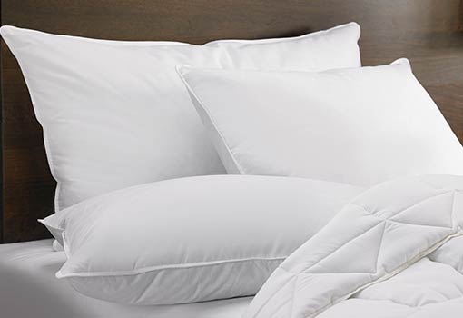 pillows and a comforter on a mattress