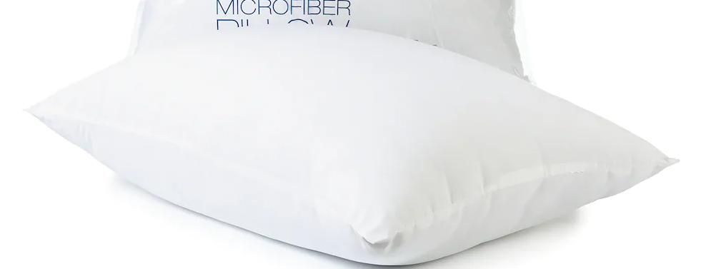 the corner and edges of a white bed pillow