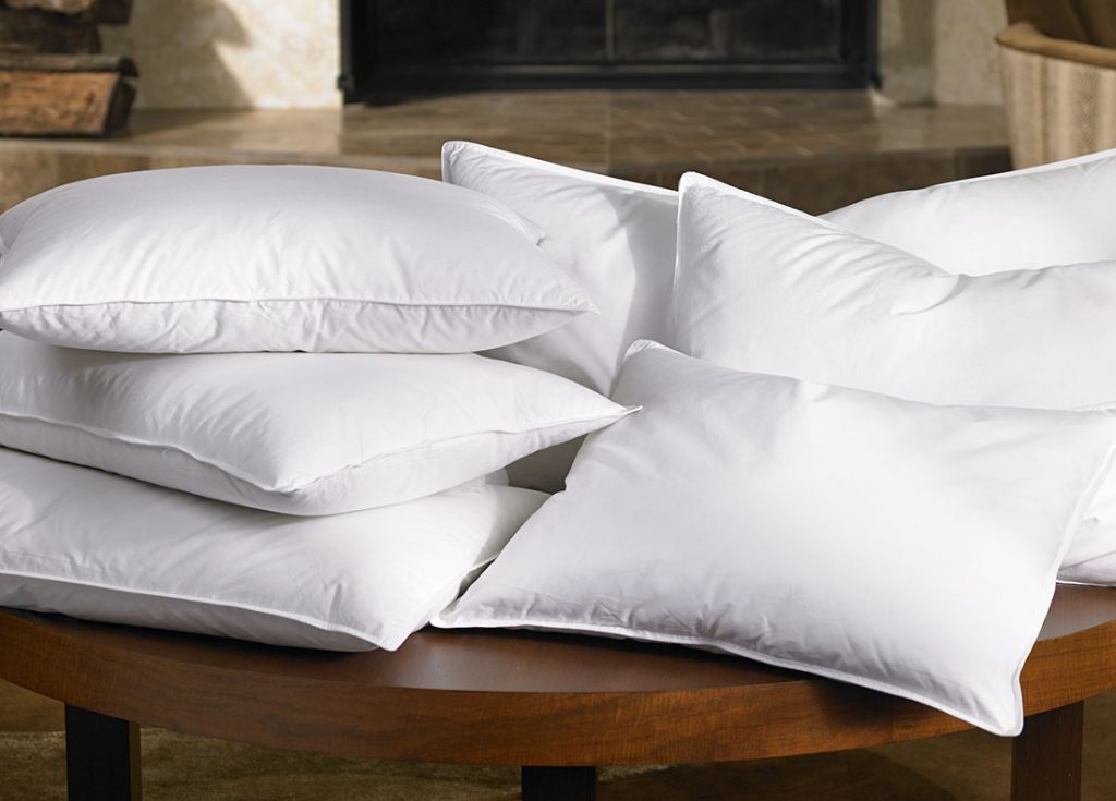 a pile of Downlite 50/50 pillows