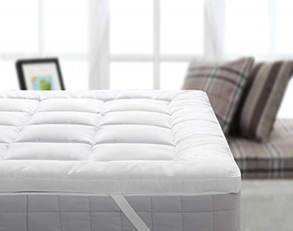 a mattress topper with anchor bands - which is fluffier and thicker than a mattress pad