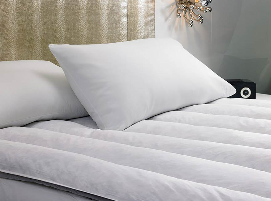 a featherbed on a W Hotel bed