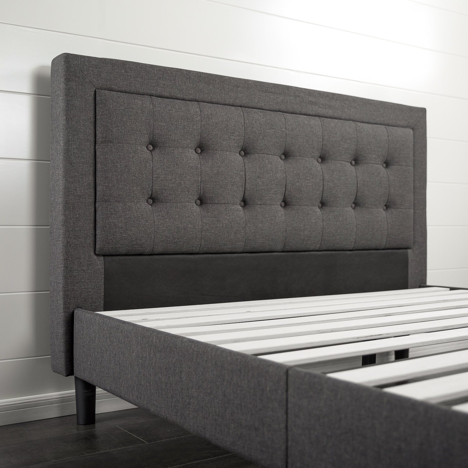 an upholstered bed frame and headboard