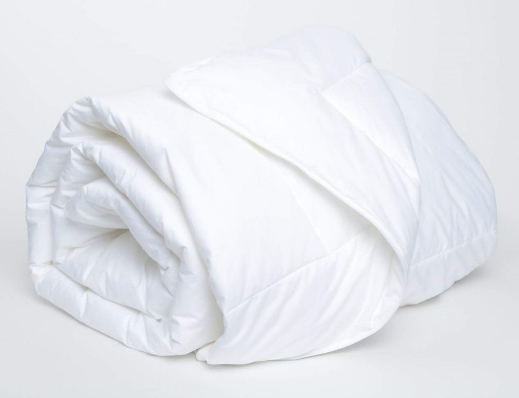 a rolled up white comforter