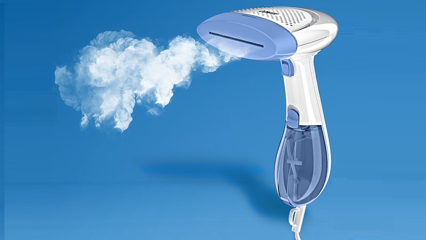 steam bellowing out of a handheld fabric steamer
