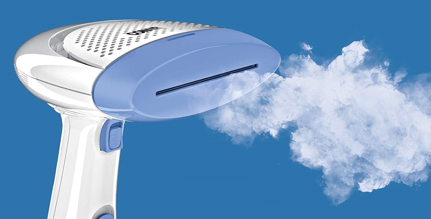 a Conair fabric steamer being used to steam
