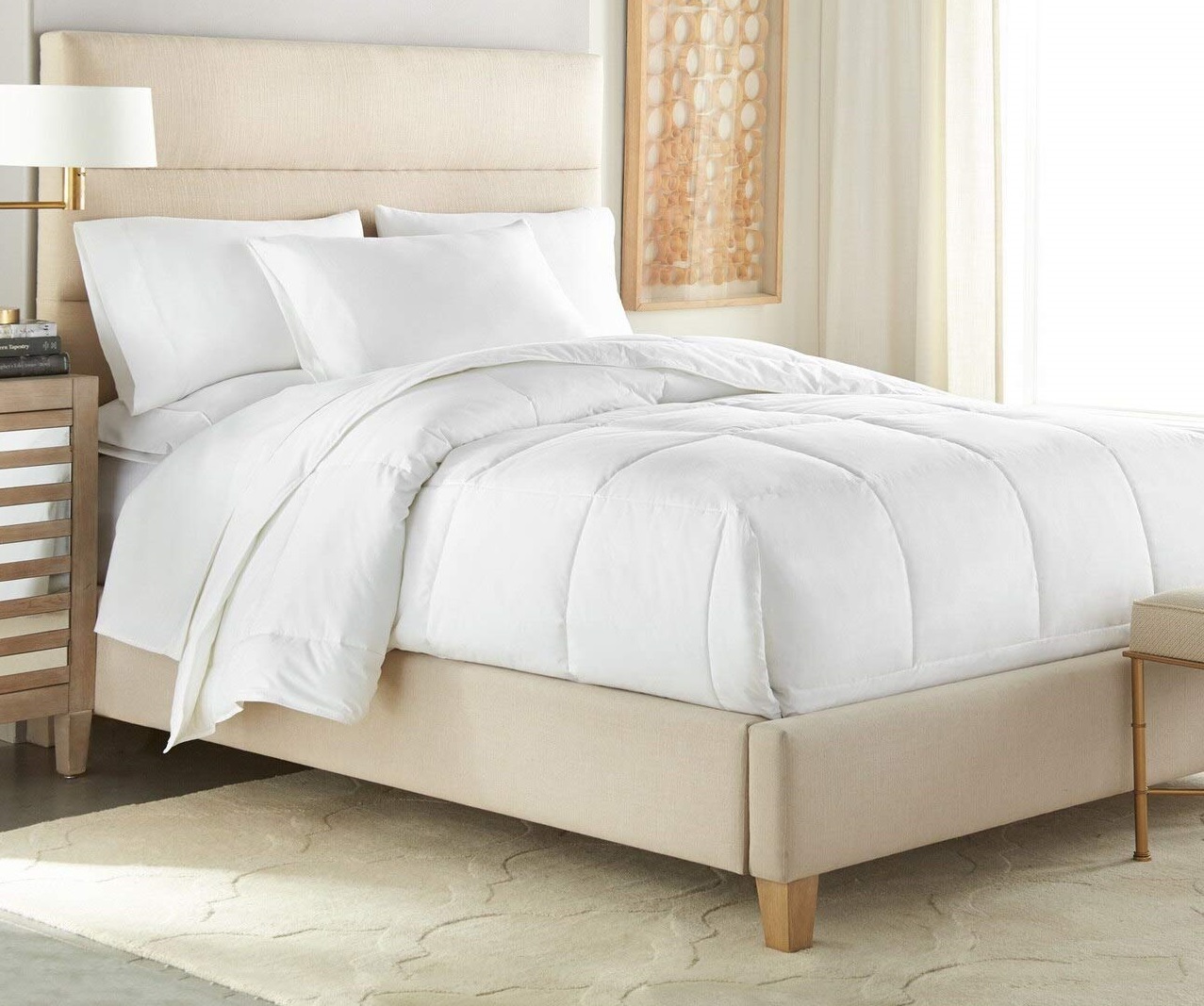 a white Downlite down alternative comforter on a bed