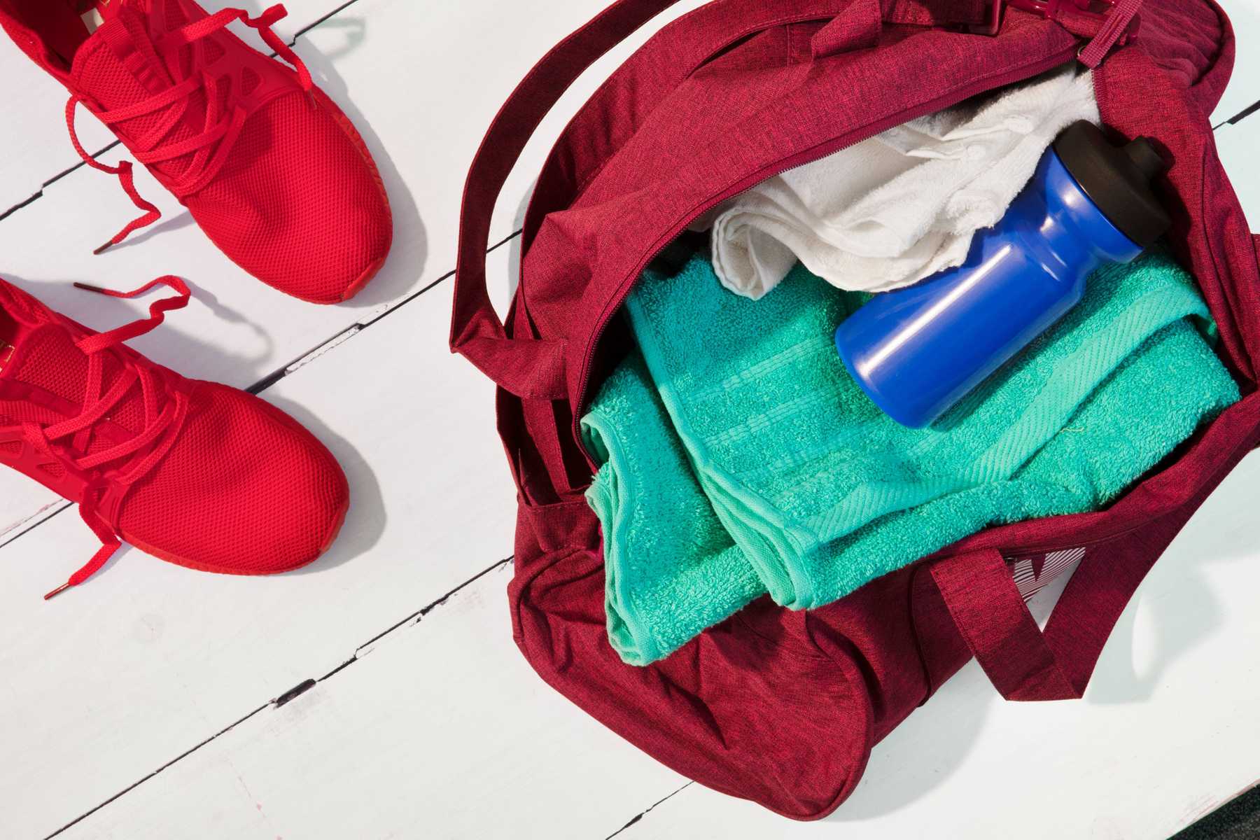 gym shoes, towels, and water bottle
