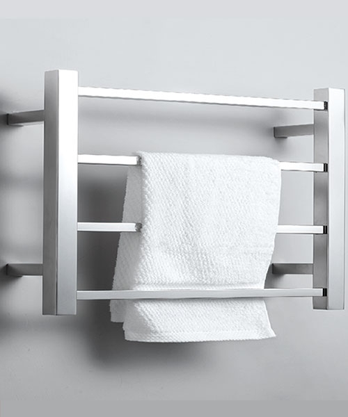 a white towel hung from a small heated towel rack