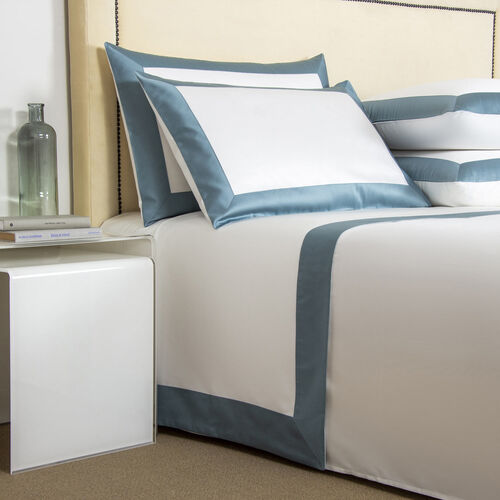 A Frette bedding set in blue and white colors