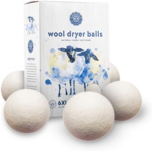 a set of wool dryer balls which are placed in the drying machine
