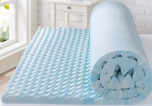 a rolled up memory foam mattress topper